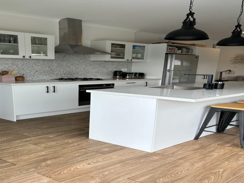Kitchen with dark hardware